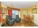 Living area with two recliners, dining set, and balcony access at 6804 N Ocean Blvd. # 1147, Myrtle Beach, SC 29572