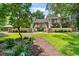 Inviting condo exterior with lush landscaping and a tranquil setting at 204 Baslow Ct. # 20-H, Myrtle Beach, SC 29572