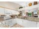 Open kitchen boasts granite countertops and white cabinets at 204 Baslow Ct. # 20-H, Myrtle Beach, SC 29572