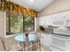 Kitchen with breakfast nook, granite counters, and white cabinetry at 204 Baslow Ct. # 20-H, Myrtle Beach, SC 29572