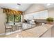 Kitchen features granite countertops, white cabinets, and breakfast bar at 204 Baslow Ct. # 20-H, Myrtle Beach, SC 29572