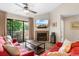 Living Room with fireplace, TV, and access to balcony at 204 Baslow Ct. # 20-H, Myrtle Beach, SC 29572