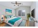 Bright bedroom with hardwood floors and ceiling fan at 3132 Robins Nest Way, Myrtle Beach, SC 29579