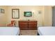 Bedroom with dresser, armchair, and flatscreen TV at 201 77Th Ave. N # 923, Myrtle Beach, SC 29572