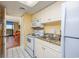 Small kitchen with white cabinets and granite countertop at 201 77Th Ave. N # 923, Myrtle Beach, SC 29572