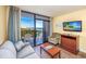 Living room with ocean view and balcony access at 201 77Th Ave. N # 923, Myrtle Beach, SC 29572