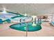 Indoor pool with lounge chairs and a relaxing atmosphere at 201 77Th Ave. N # 923, Myrtle Beach, SC 29572