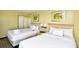 Guest bedroom with two double beds and ocean view at 2301 S Ocean Blvd. # Ph22, Myrtle Beach, SC 29577