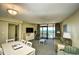 Living room with ocean view, seating, and dining area at 2301 S Ocean Blvd. # Ph22, Myrtle Beach, SC 29577