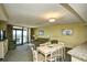 Living room features ocean view, sofa, and dining table at 2301 S Ocean Blvd. # Ph22, Myrtle Beach, SC 29577