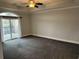 Bright bedroom with carpeting, a ceiling fan, and access to balcony at 249 Venice Way # 3105, Myrtle Beach, SC 29577