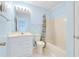 Clean bathroom with shower/tub combo, white vanity, and light blue walls at 4633 Lightkeepers Way # 5-C, Little River, SC 29566