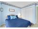 Bright bedroom with double bed, built-in closet, and nautical-themed decor at 4633 Lightkeepers Way # 5-C, Little River, SC 29566