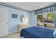 Light blue bedroom with a double bed at 4633 Lightkeepers Way # 5-C, Little River, SC 29566