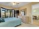 Bedroom with dresser, TV, and sliding doors to balcony at 4633 Lightkeepers Way # 5-C, Little River, SC 29566