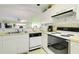 Well-equipped kitchen with white cabinets, dishwasher, and gas range at 4633 Lightkeepers Way # 5-C, Little River, SC 29566