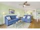 Living area with two blue sofas and a view into the kitchen at 4633 Lightkeepers Way # 5-C, Little River, SC 29566
