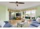 Bright living room with water views, comfy sofas, and a glass coffee table at 4633 Lightkeepers Way # 5-C, Little River, SC 29566