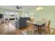 Living room with hardwood floors, gray sofa, and water views at 4633 Lightkeepers Way # 5-C, Little River, SC 29566