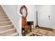 Entryway with hardwood floors, antique furniture, and carpeted stairs at 4739 Cloisters Ln., Myrtle Beach, SC 29577