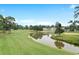 Landscaped golf course with pond and mature trees at 4739 Cloisters Ln., Myrtle Beach, SC 29577