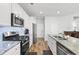 Kitchen with white cabinets, granite countertops, stainless steel appliances, and island at 4739 Cloisters Ln., Myrtle Beach, SC 29577