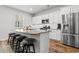 Kitchen with island, granite countertops, stainless steel appliances, and barstools at 4739 Cloisters Ln., Myrtle Beach, SC 29577