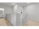 Upstairs hallway with carpet and access to bathroom at 4739 Cloisters Ln., Myrtle Beach, SC 29577