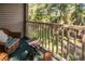 Private balcony with wicker furniture and wooded views at 598 Blue Stem Dr. # 52D, Pawleys Island, SC 29585