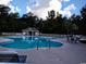 Relaxing community pool with surrounding lounge chairs at 598 Blue Stem Dr. # 52D, Pawleys Island, SC 29585
