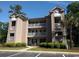 Attractive two-story building with balconies and landscaping at 598 Blue Stem Dr. # 52D, Pawleys Island, SC 29585