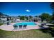Community pool with lounge chairs and a clubhouse at 598 Blue Stem Dr. # 52D, Pawleys Island, SC 29585