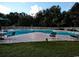 Community pool with surrounding lawn and trees at 598 Blue Stem Dr. # 52D, Pawleys Island, SC 29585