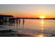 Tranquil sunset view over calm water with pier at 598 Blue Stem Dr. # 52D, Pawleys Island, SC 29585