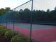Tennis court with chain-link fence and green landscaping at 598 Blue Stem Dr. # 52D, Pawleys Island, SC 29585