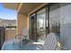 Private balcony with chairs and rug, offering ocean view at 7500 Ocean Blvd. N # 6010, Myrtle Beach, SC 29572