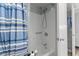 Bathroom with shower/tub combo and striped curtain at 7500 Ocean Blvd. N # 6010, Myrtle Beach, SC 29572
