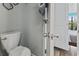 Small bathroom with toilet and access to bedroom at 7500 Ocean Blvd. N # 6010, Myrtle Beach, SC 29572