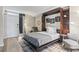 Bedroom with murphy bed, dresser, and access to balcony at 7500 Ocean Blvd. N # 6010, Myrtle Beach, SC 29572