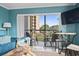 Living room with balcony access, comfy seating, and ocean view at 7500 Ocean Blvd. N # 6010, Myrtle Beach, SC 29572