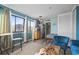 Open living room with bed, kitchenette and seating at 7500 Ocean Blvd. N # 6010, Myrtle Beach, SC 29572