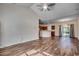 Spacious living room with hardwood floors, high ceilings and a view of the kitchen at 100 Barons Bluff Dr., Conway, SC 29526