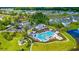 Aerial view showcasing Heather Glen's community pool, clubhouse, and surrounding homes at 104 Kings Acre Ct., Little River, SC 29566