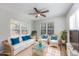 Bright sunroom with white wicker furniture and large windows at 1108 Patricia Ct., Conway, SC 29526