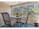 Private patio with table and chairs, overlooking trees at 1109 Blue Stem Dr. # 34D, Pawleys Island, SC 29585