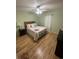 Bright bedroom with queen-size bed and wood floors at 127 Willard St., Little River, SC 29566