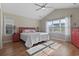 Spacious bedroom with large window, hardwood floors, and red dresser at 1413 Half Penny Loop, Conway, SC 29526