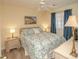 Bright bedroom with king bed and coastal decor at 1900 Duffy St. # H8, North Myrtle Beach, SC 29582