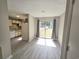 Bright dining area with sliding glass doors and kitchen view at 200 Myrtle Greens Dr. # A, Conway, SC 29526