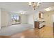 Dining area with chandelier, hardwood floors, and open kitchen at 2258 Essex Dr. # G, Surfside Beach, SC 29575